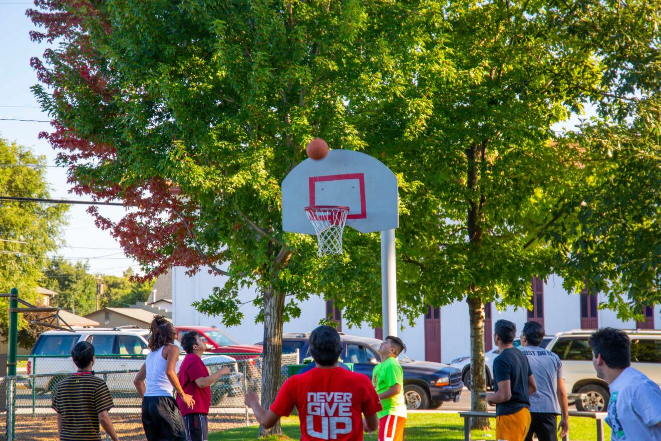 Many of the young men playing basketball in Madras grew up together.